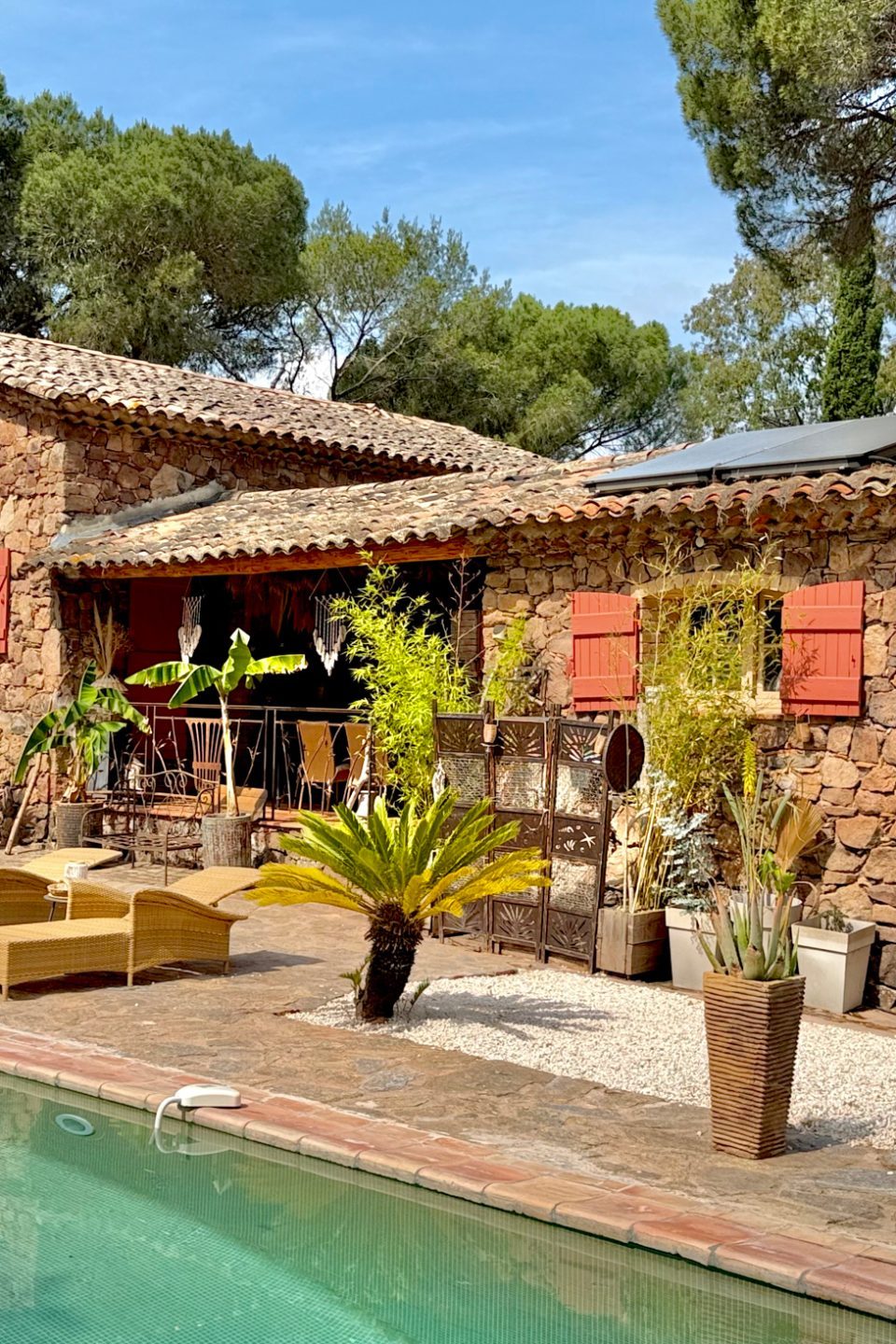 Stone house, lounge chairs